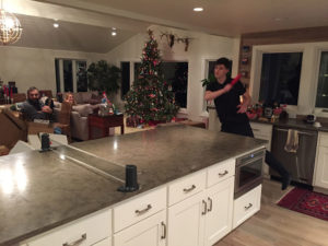 Family Playing Ping Pong in Kitchen